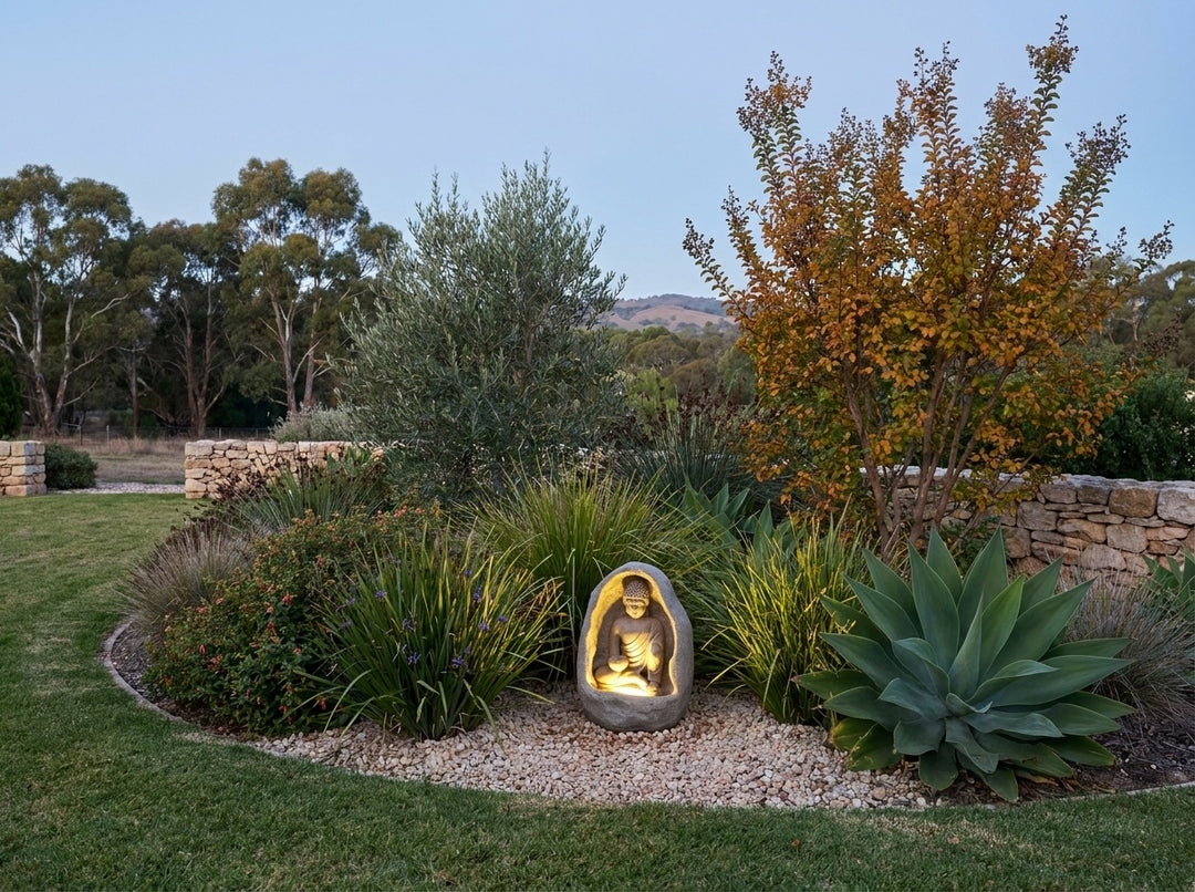 Harmony Small Water Feature in an established Adelaide Hills garden at dusk, water running and its integrated LED lighting glowing
