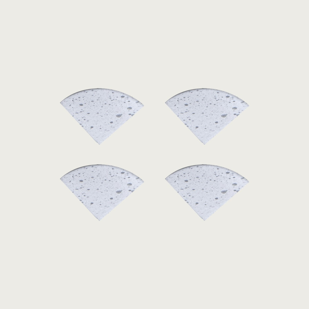 Four Blizzard soft white speckled terrazzo pot feet — one set of four, for a round or square pot