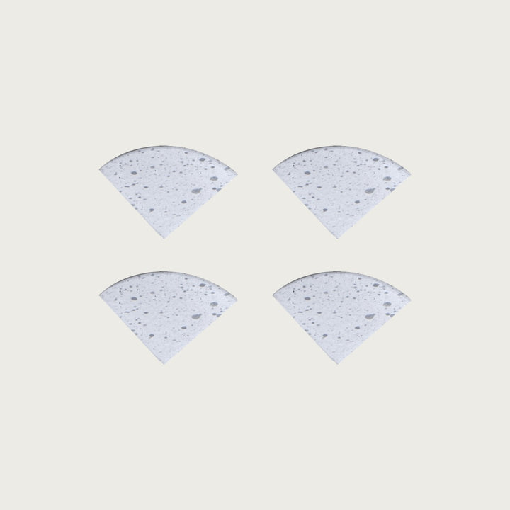 Four Blizzard soft white speckled terrazzo pot feet — one set of four, for a round or square pot