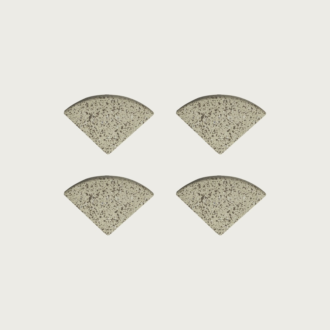 Four Nougat pale warm-beige terrazzo pot feet — one set of four, for a round or square pot