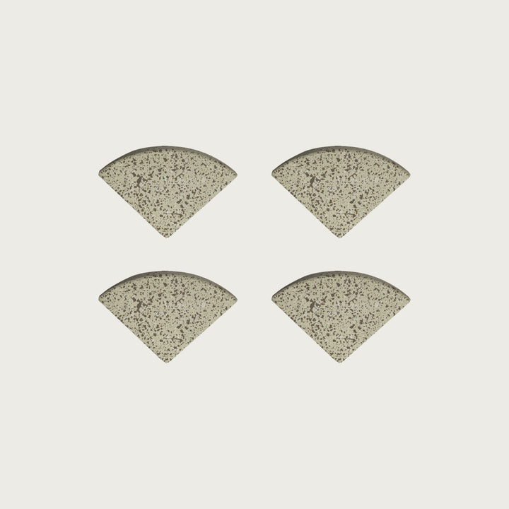 Four Nougat pale warm-beige terrazzo pot feet — one set of four, for a round or square pot