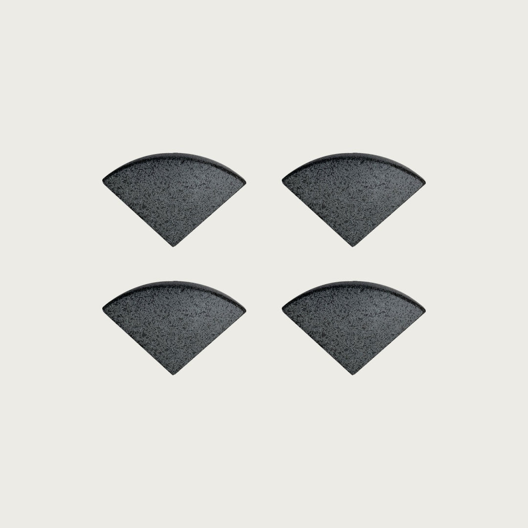 Four Onyx deep near-black terrazzo pot feet — one set of four, for a round or square pot